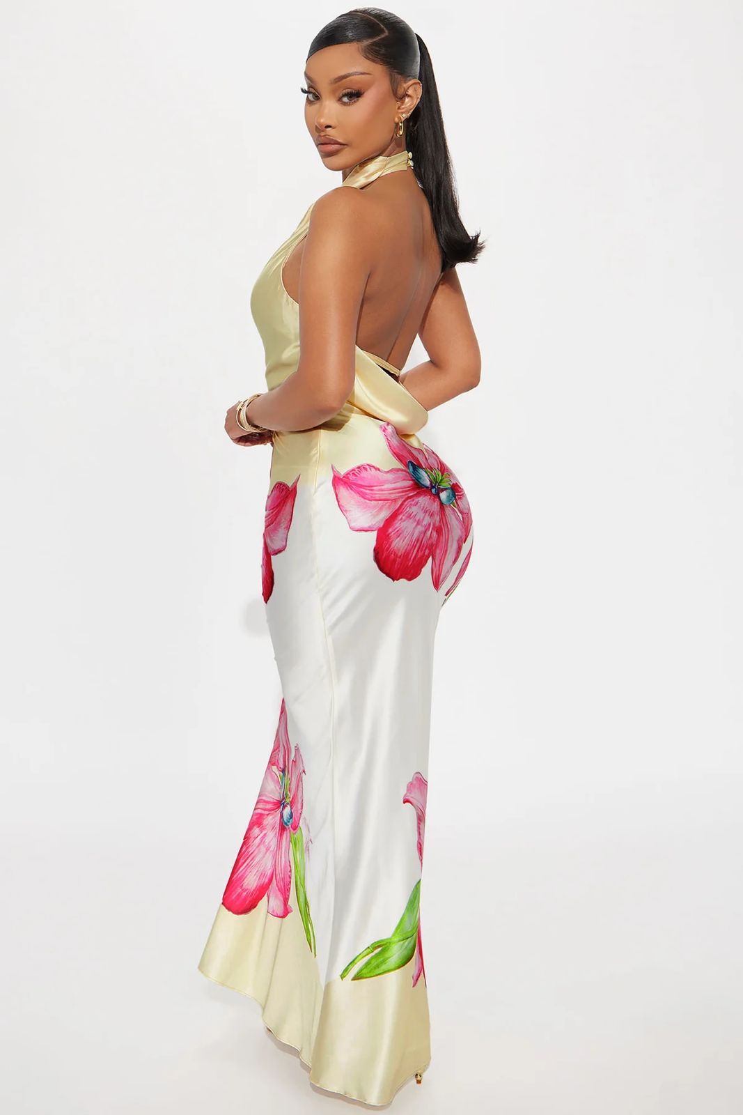 Woman wearing a floral dress with a white background